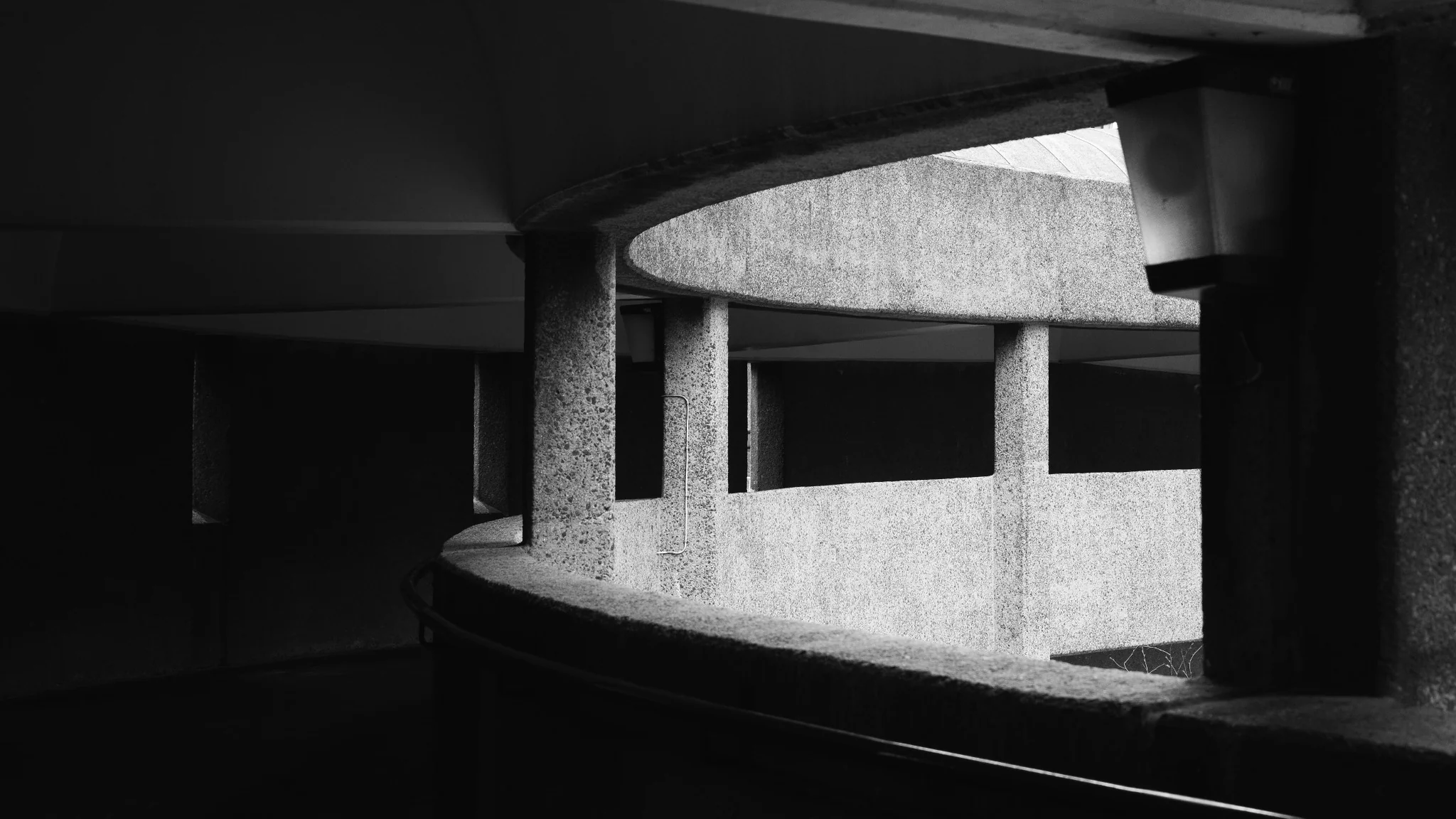 Abstract black and white study of curved brutalist concrete